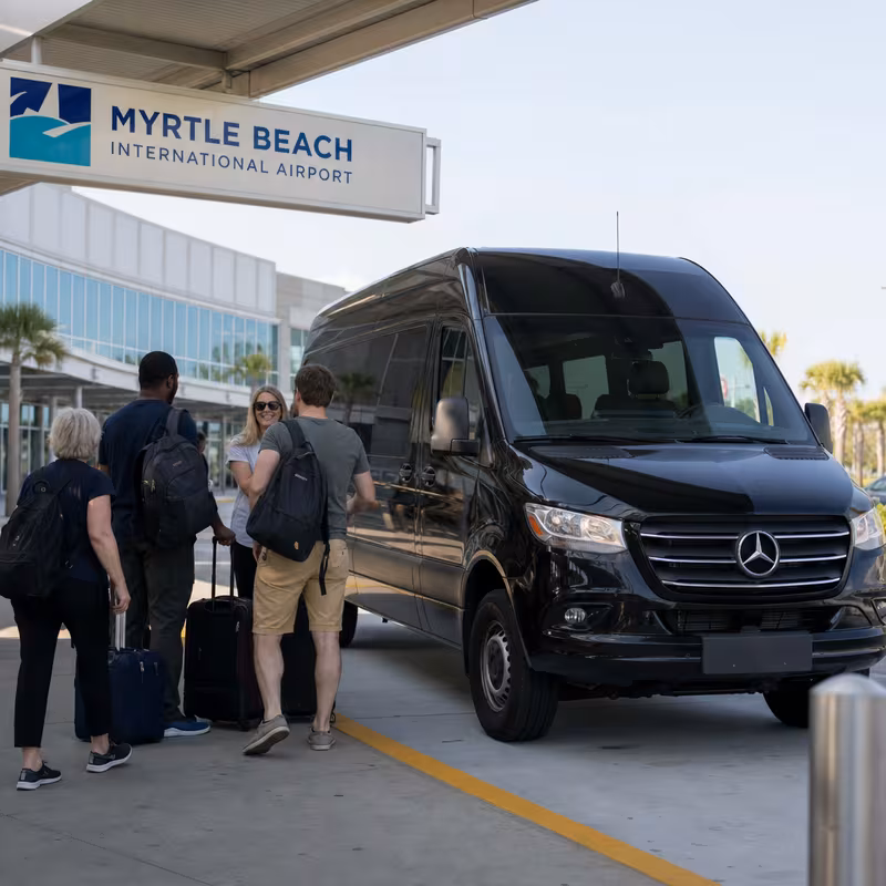 Group boarding a white charter bus for Airport Transportation transportation in Myrtle Beach