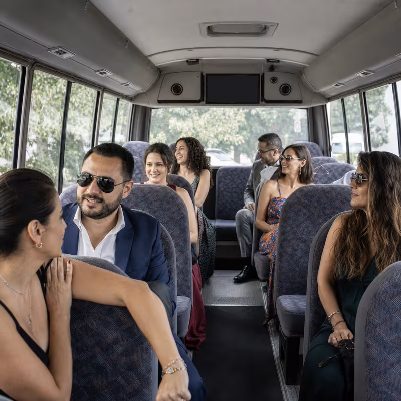 Group boarding a white charter bus for Private Event Transportation transportation in Myrtle Beach