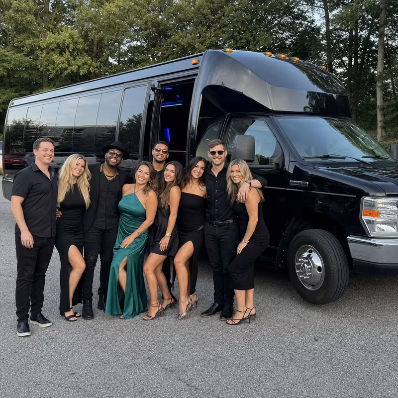 Passengers loading luggage while boarding an Myrtle Beach group shuttle