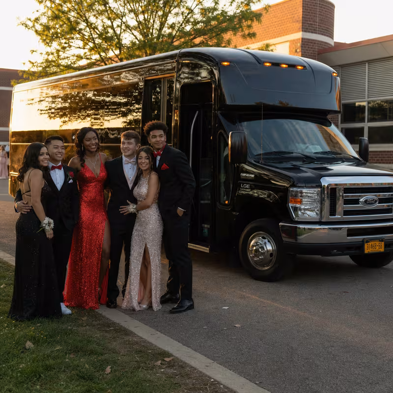 Group boarding a white charter bus for Prom & Homecoming Transportation transportation in Myrtle Beach
