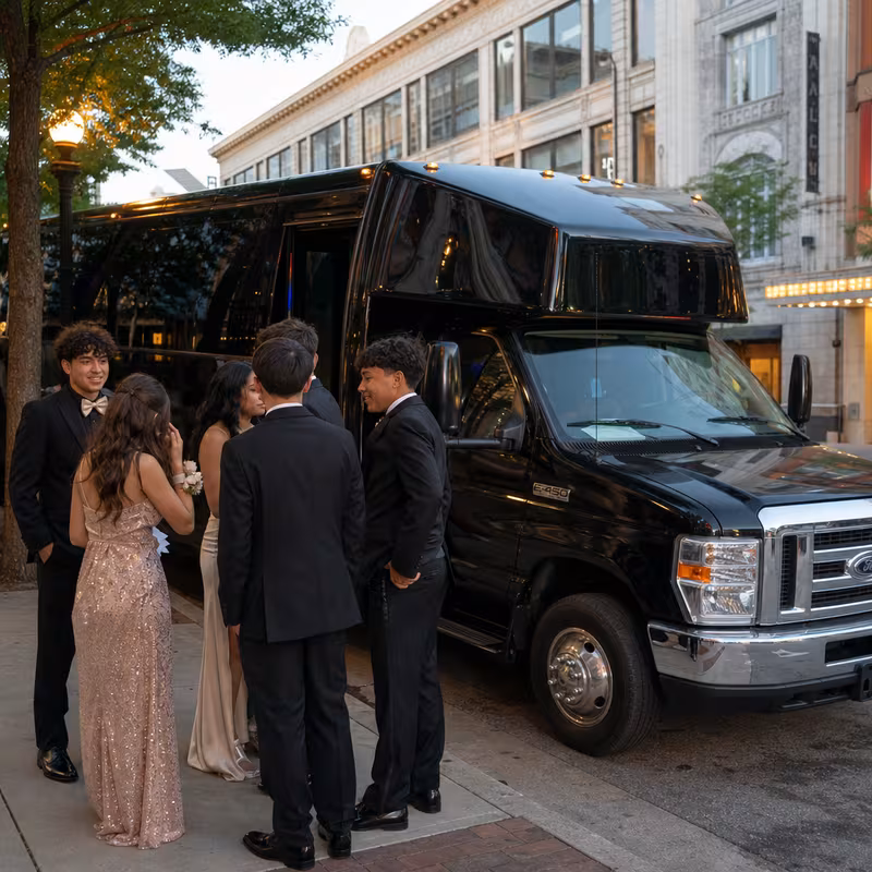 Passengers loading luggage while boarding an Myrtle Beach group shuttle