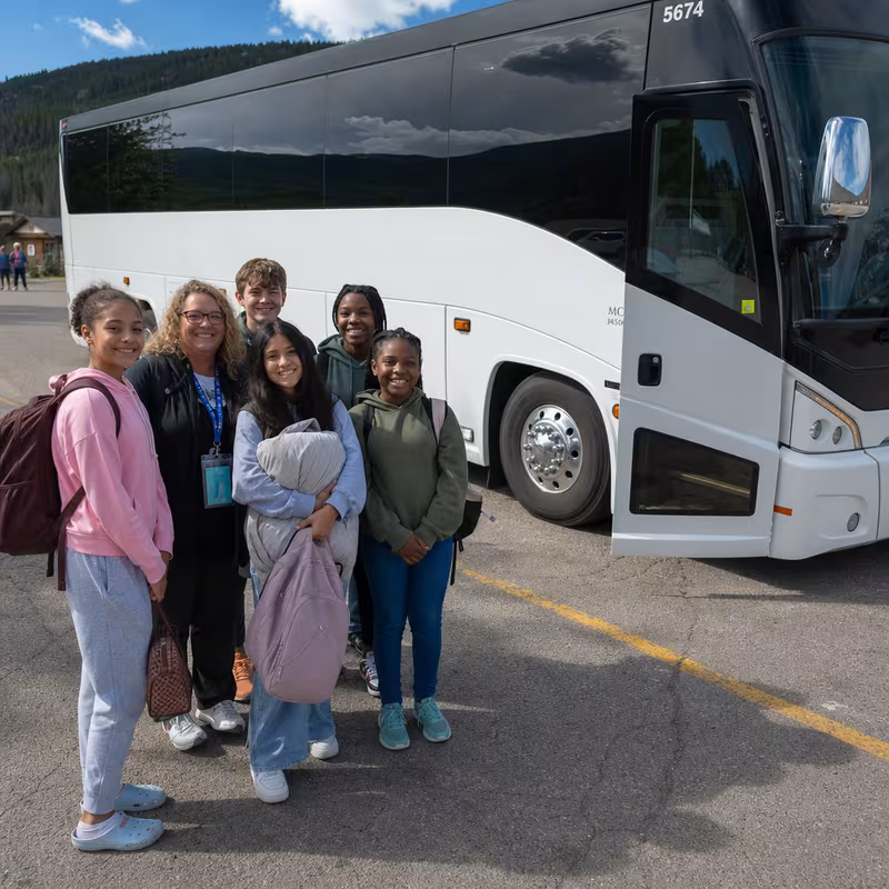 Passengers loading luggage while boarding an Myrtle Beach group shuttle